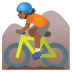 🚵🏾 person mountain biking: medium-dark skin tone display on Google